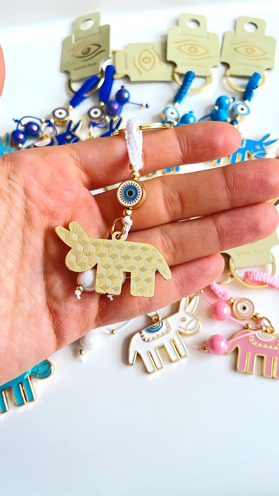 White Donkey Design Gold Evil Eye Keychain